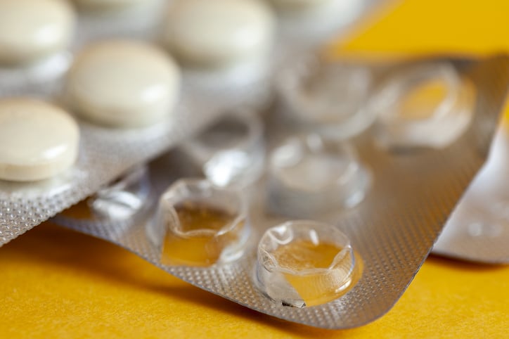 yellow tablet pills in packaging